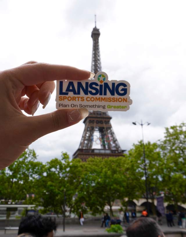 Lansing Sports Commission sticker in front of Eiffel Tower