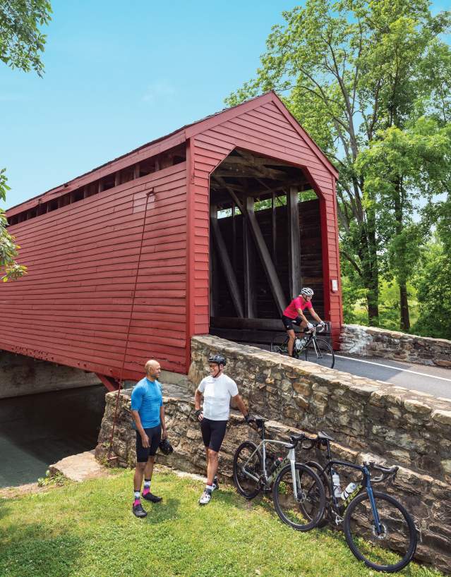 Loys Station Covered Bridge with cyclists.