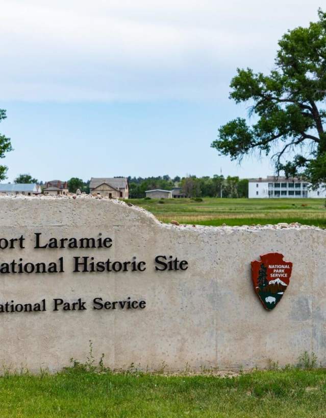 Historic structures at Fort Laramie National Historic Site surrounded by open grasslands in Goshen County, Wyoming.