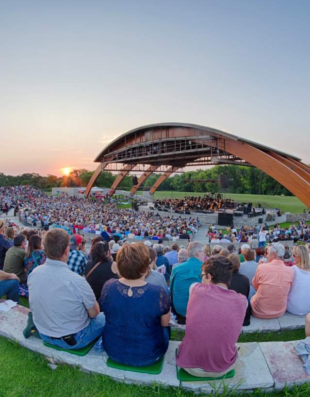 people watching a concert outside at bluestem amphitheater