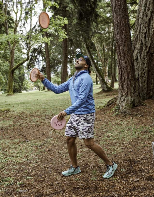 A person playing disc golf.