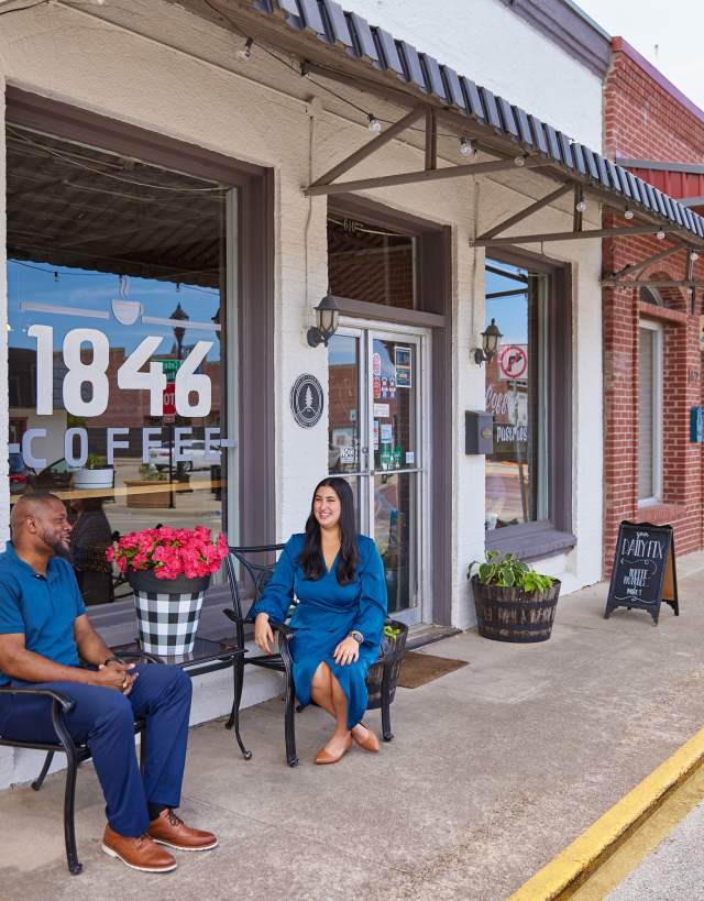 couple outside coffee shop in downtown