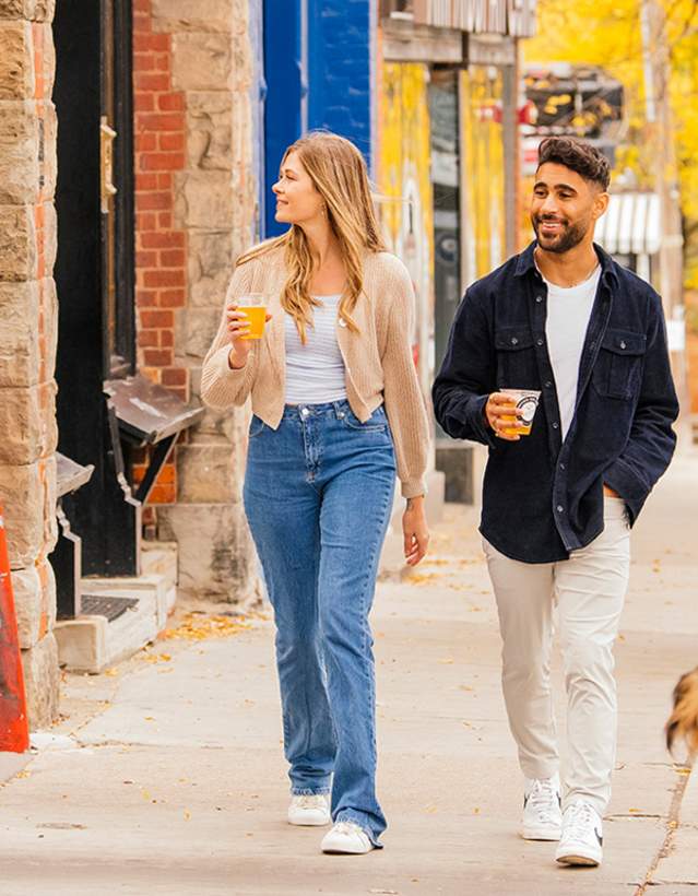 Couple walking down sidewalk in downtown Ann Arbor