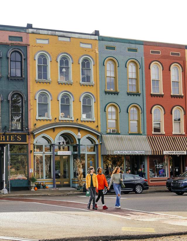 Three woman walking in Depot Town, Ypsilanti
