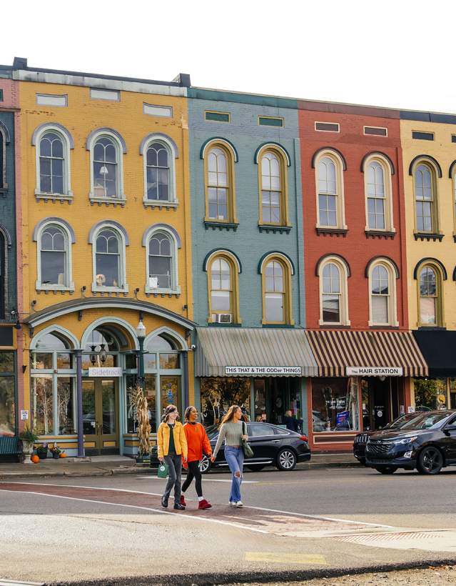 Three woman walking in Depot Town, Ypsilanti