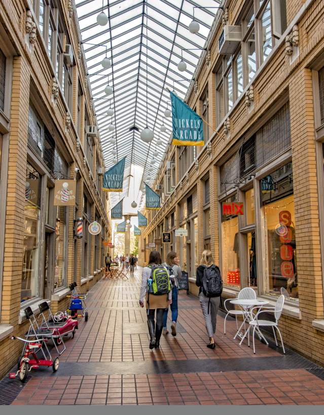 Young people walkig through Nickels Arcade