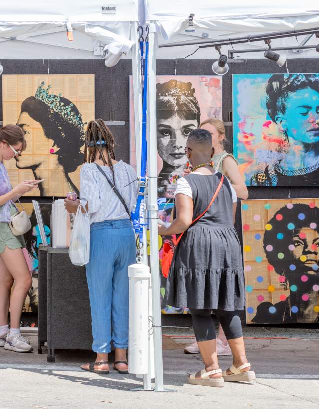 People looking at art during Ann Arbor Art Fair