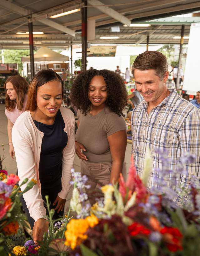 Group of people looking at items at the Ann Arbor Farmers Market