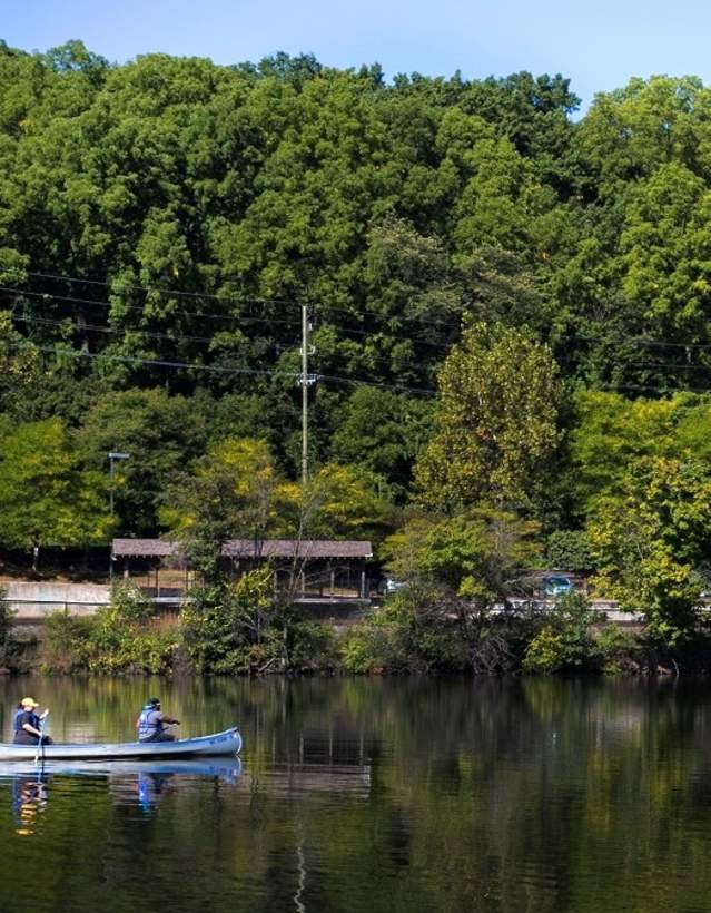 Two people canoeing on the Huron River