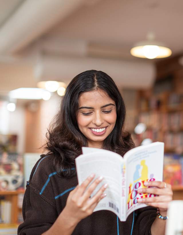 Woman reading book in Literati