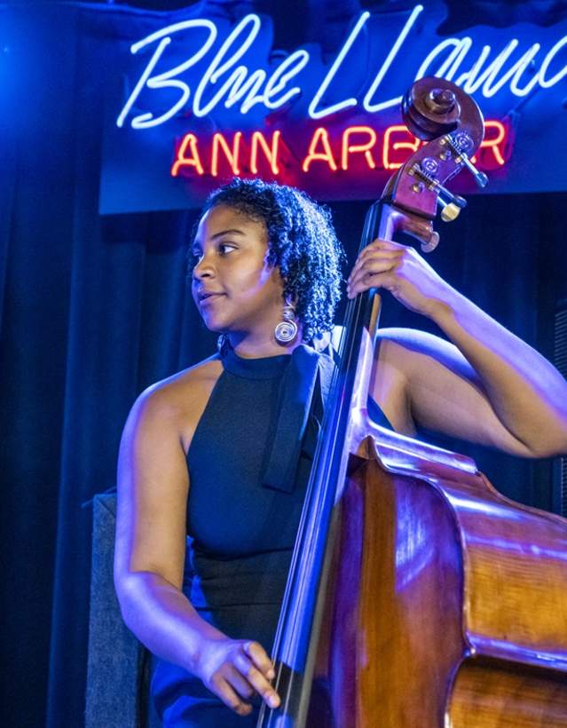 Musician performs at blue llama jazz club