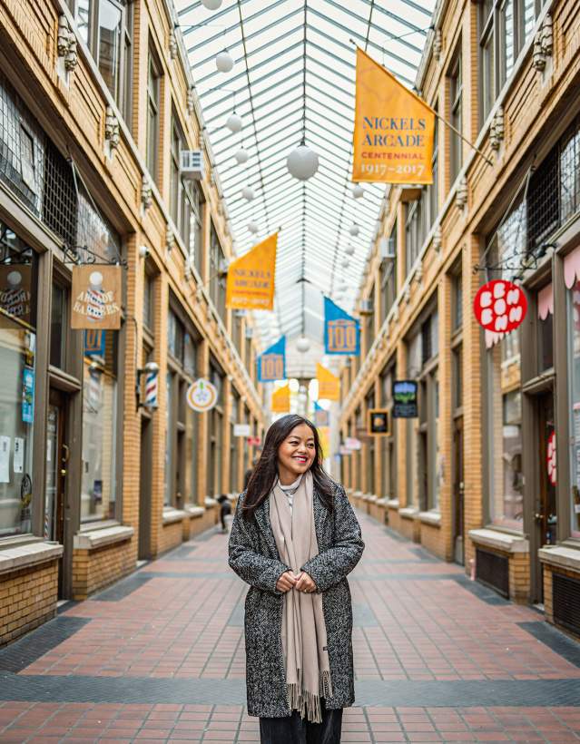Rachel Kawate walking through Nickels Arcade