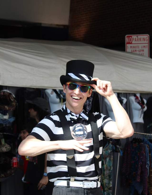 Mime in black and white with top hat and sunglasses