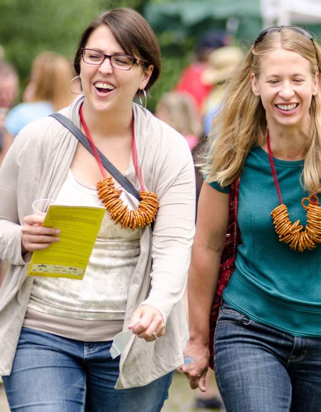 Two smiling women at Beer Festival