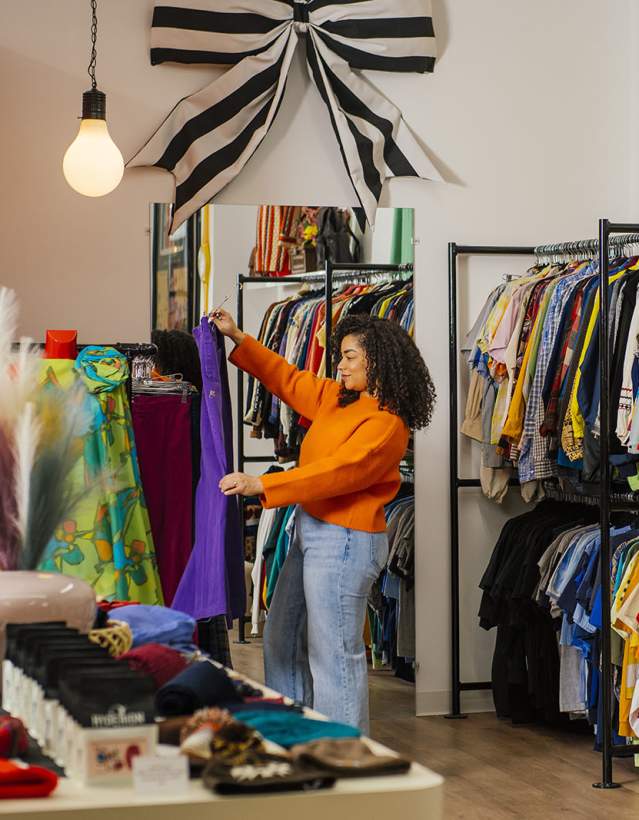 Woman shopping at vintage clothing store