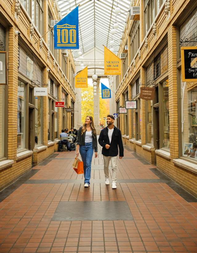 Young couple walking through covered outdoor walkway
