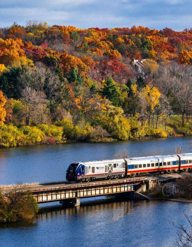 Amtrack Train crossing Huron River in Fall