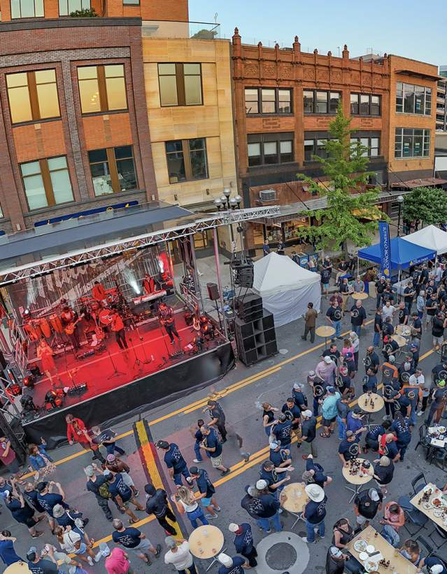 Aerial view of a UA block party with a band playing