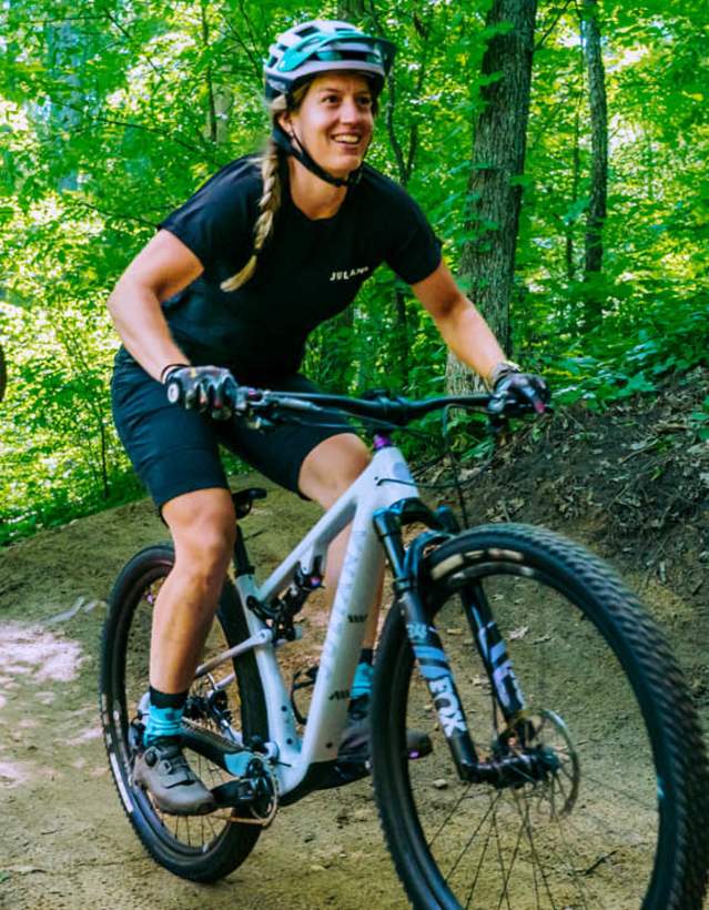 2 Waterloo mountain bikers riding on dirt trail in the woods