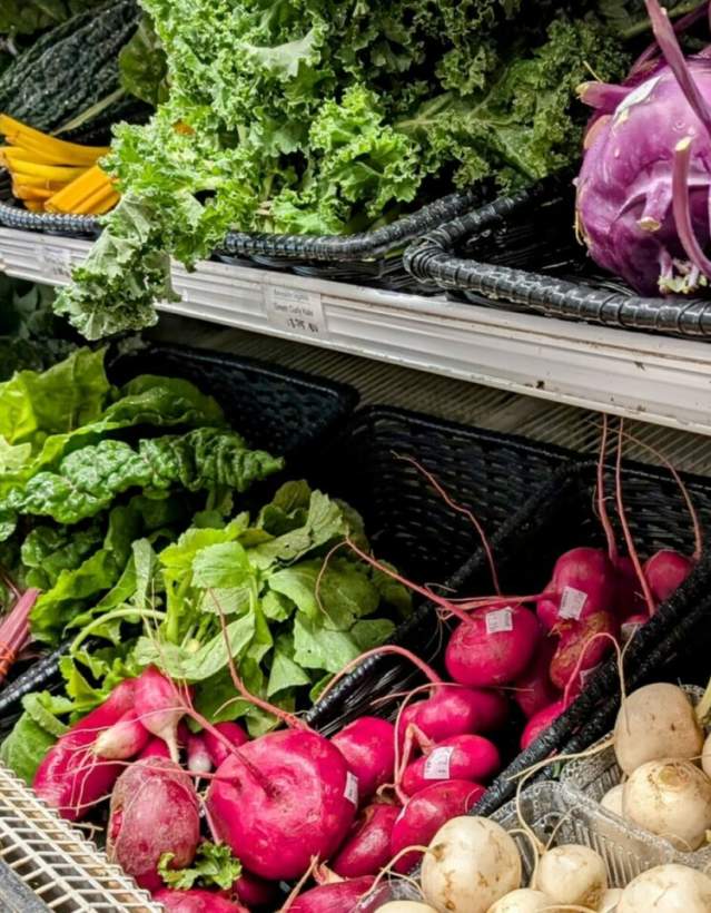 Shelves of fresh vegetables and produce