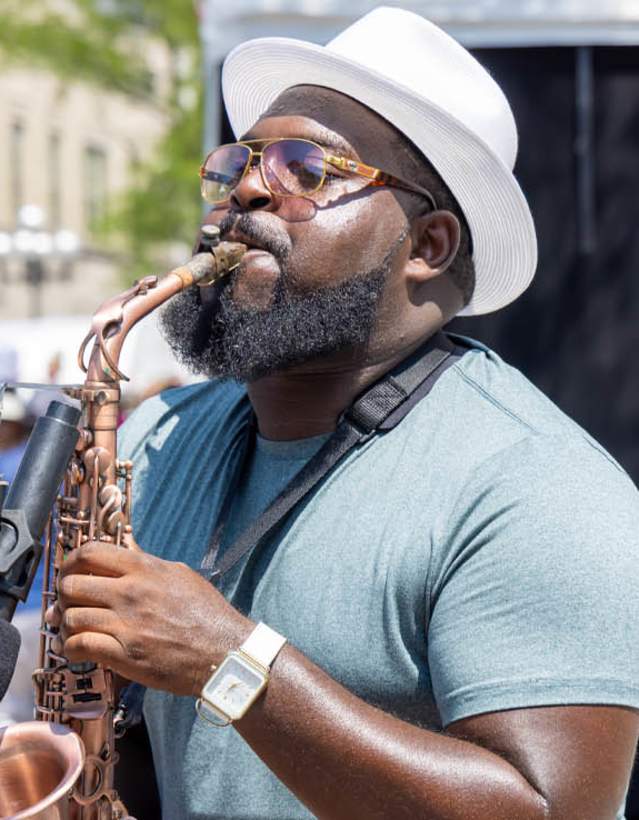 Main playing the saxophone at the Art Fair