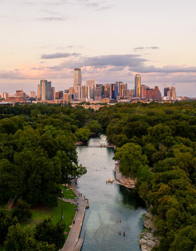 Aerial view of Barton Springs Pool and downtown Austin Texas skyline