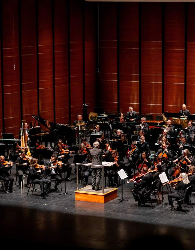 Image the Austin Symphony Orchestra performing on stage.
