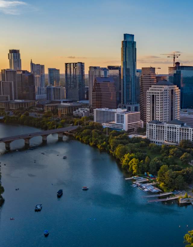 Aerial view of the Austin downtown skyline from the east, with a view of Lady Bird Lake.