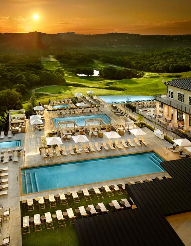Aerial view of the pools at sunset at Omni Barton Creek Resort and Spa in Austin Texas