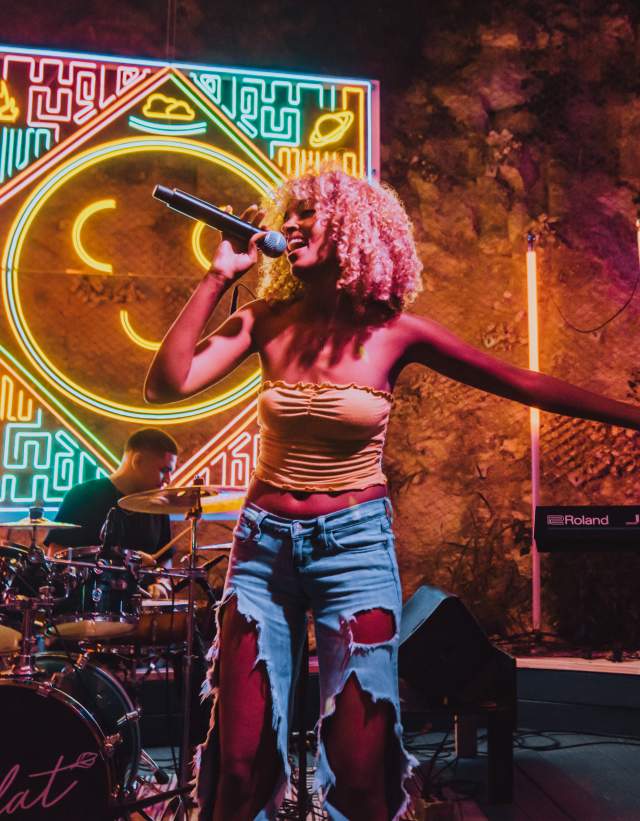 Melat performing at Cheer Up Charlie's