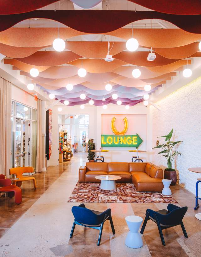 Image of the Austin Visitor Center rentable space filled with a leather couch and chairs.