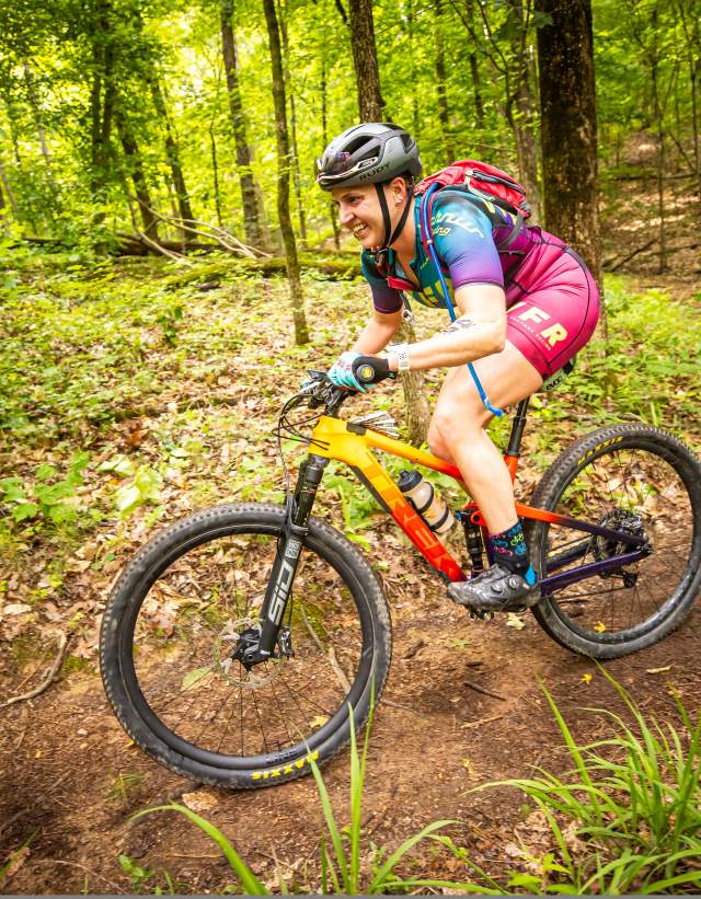 A mountain biker competes in the XTERRA North American Championship on the trails at Oak Mountain State Park.