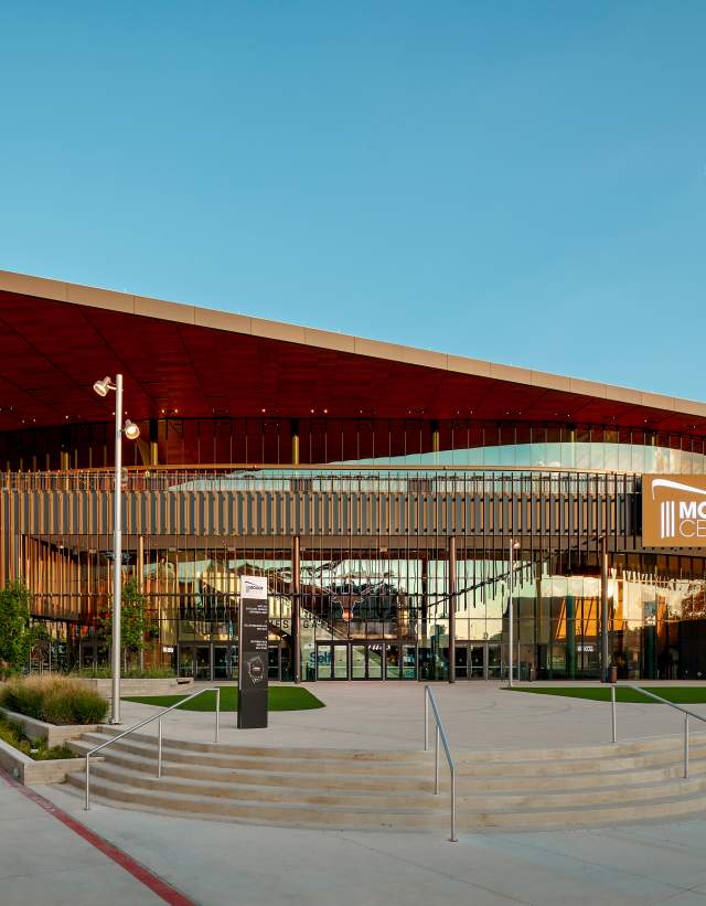 Exterior of Moody Center at University of Texas at Austin on a clear day.