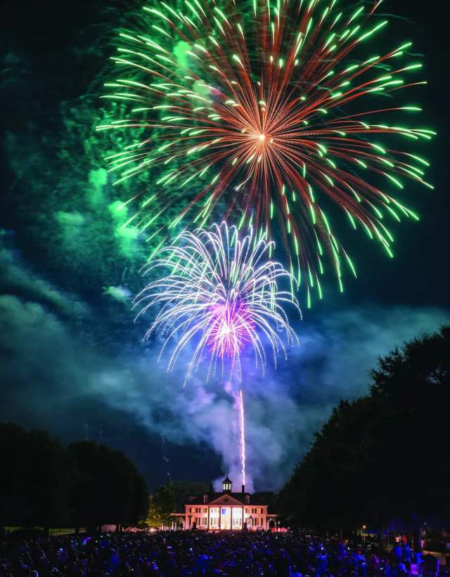 A bright and beautiful fireworks show takes place over the historic buildings of American Village in Montevallo.