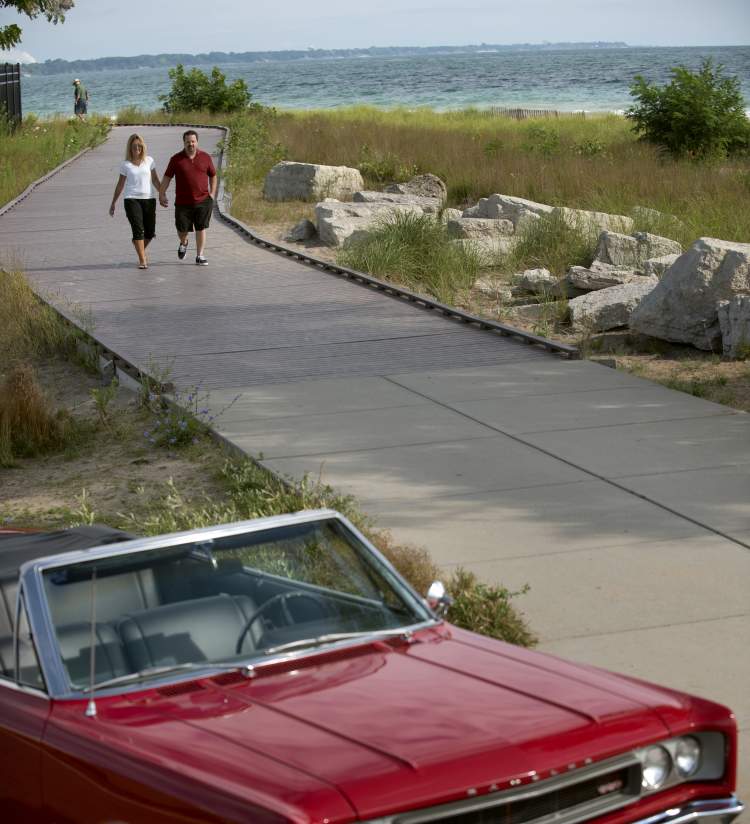 Couple Holding Hands & Red Convertible