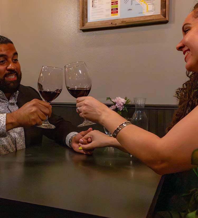 couple toasting at Wine Knot