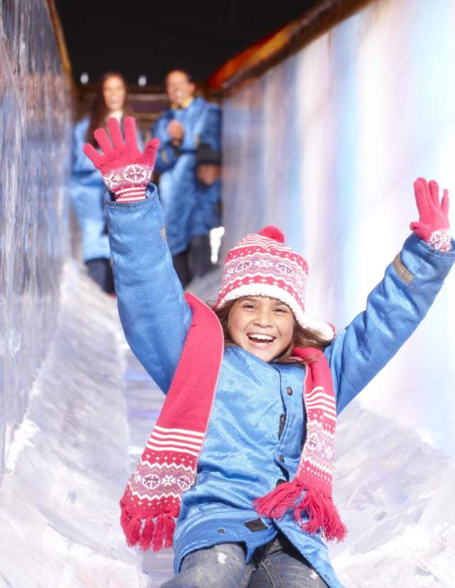 Child going down ice slide