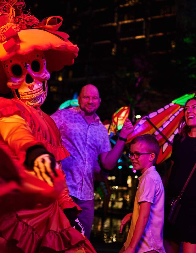 Family dressing with woman dressed in sugar skull attire