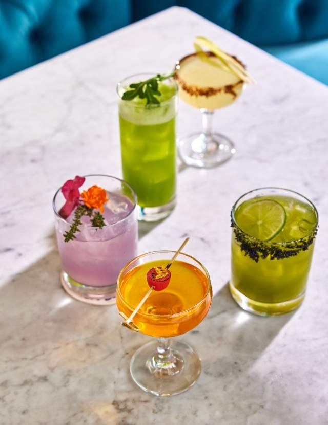 Assortment of cocktail drinks on table