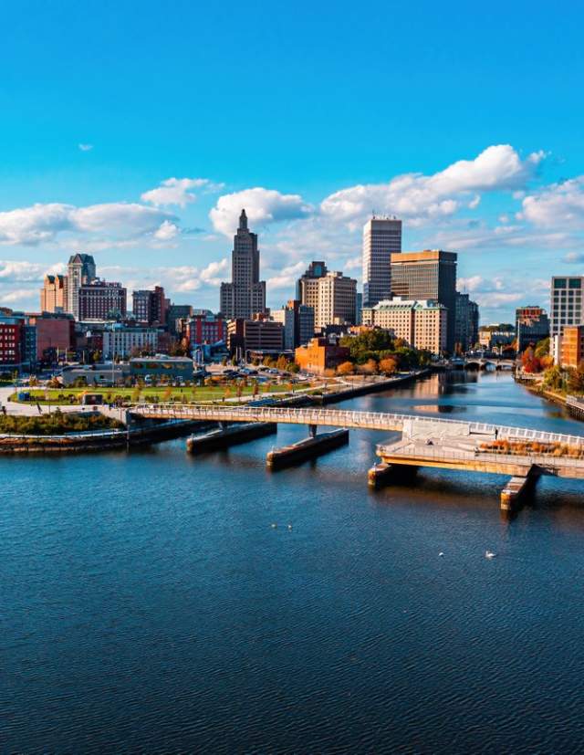 The Providence River Pedestrian Bridge spanning the Providence River with the Providence skyline in the background.