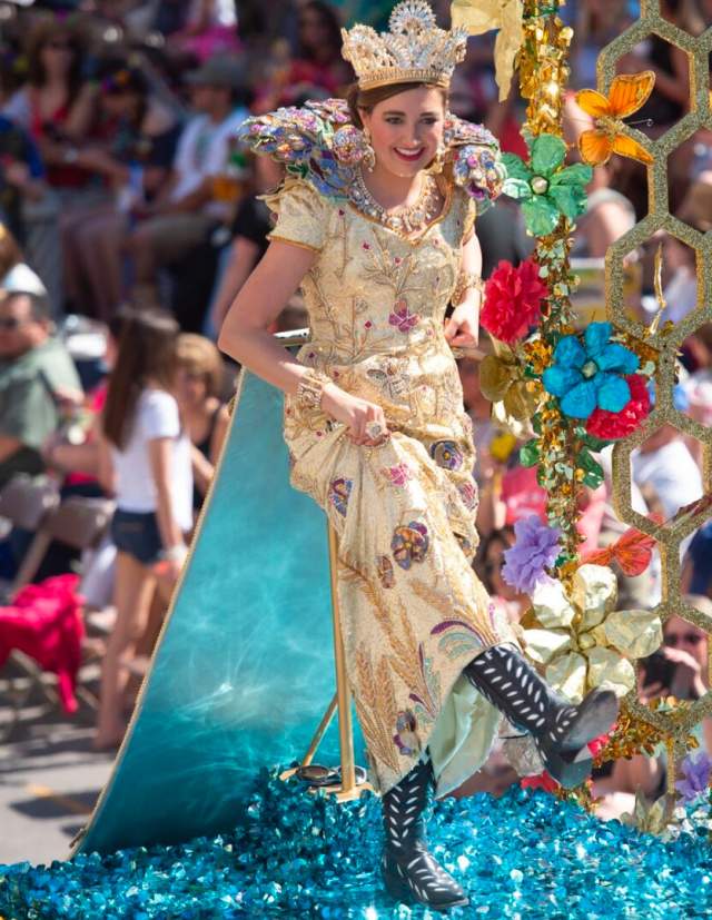 Fiesta royalty showing shoes at Battle of Flowers parade