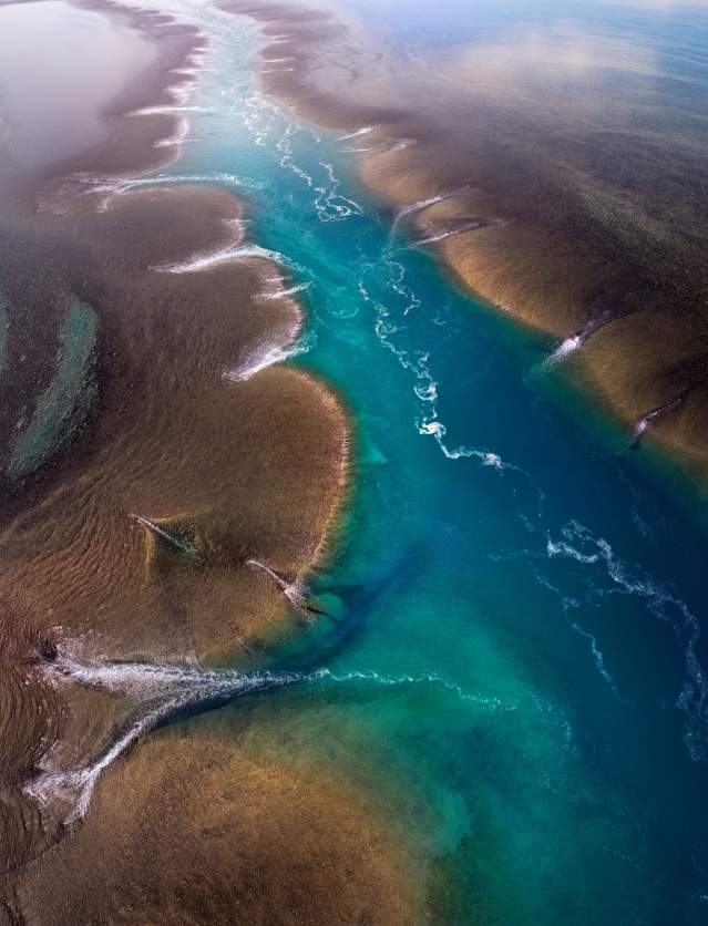 Aerial view of a channel flowing through Yowjab/Montgomery Reef on the Kimberley Coast