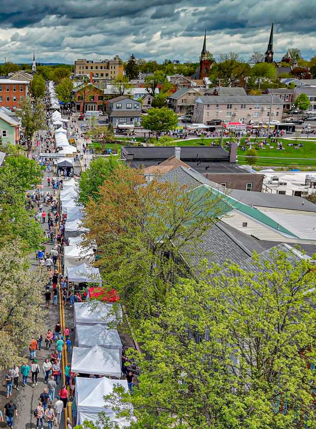 Picture of Lewisburg Arts Festival from an ariel perspective looking down market street above the vendor tents.