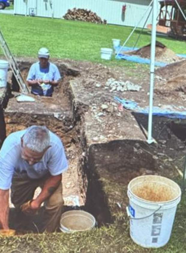 Volunteers digging at an archaeological site circa 2022.