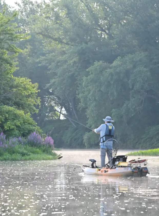 Kayak Fisherman on a creek.