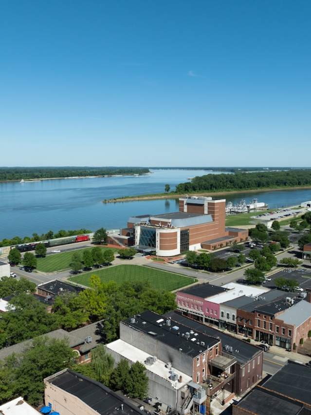 An aerial view of downtown Paducah with the Ohio and Tennessee rivers in the background.