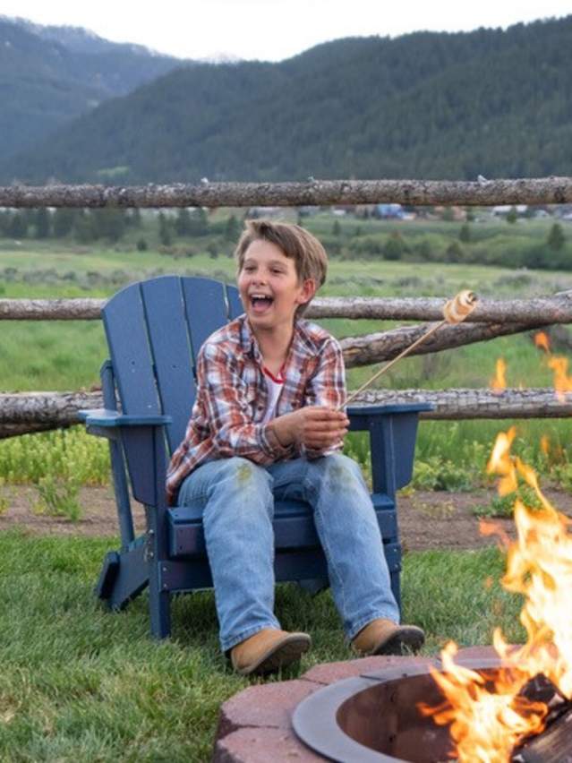 Family enjoying smores around a campfire