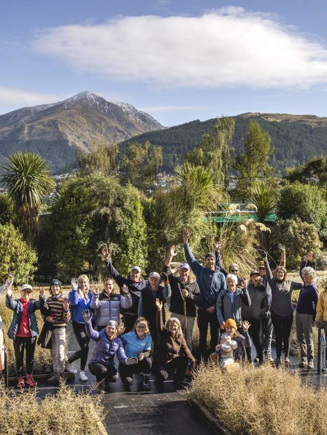 Group of volunteers together posing for a photo at Whakatipu Reforestation Trust nursery