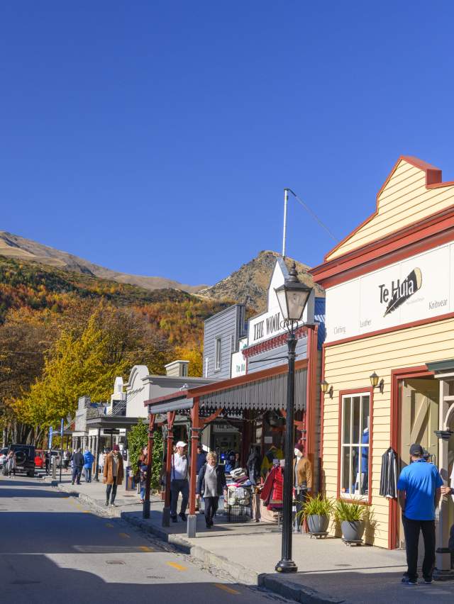 Shoppers walking along Buckingham Street, Arrowtown in Autumn