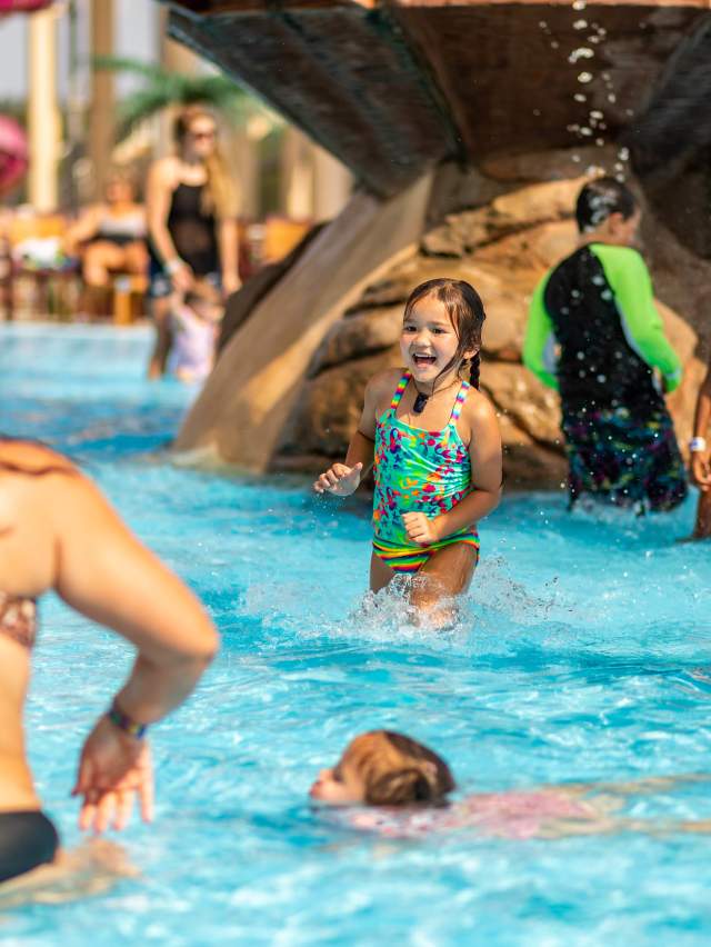 Families enjoy Parrot Island Waterpark pools during the summer.
